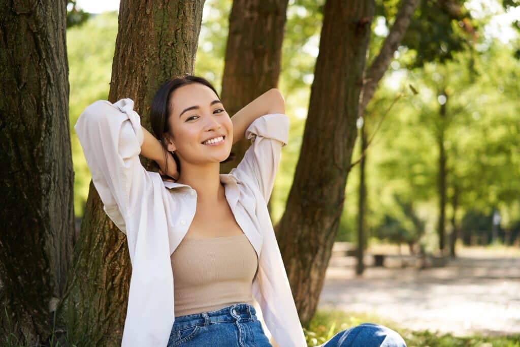 Portrait,Of,Beautiful,Asian,Woman,Resting,Near,Tree,,Relaxing,In