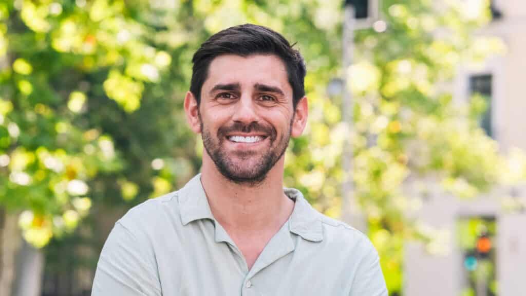 Happy,Man,Looking,At,Camera,In,City,Park,During,Daytime