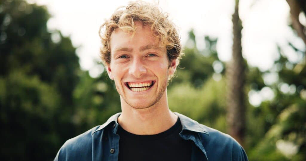 Portrait,,Happy,Man,And,College,Student,In,Park,On,Campus