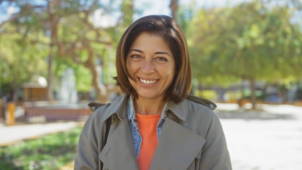 Smiling,Hispanic,Woman,Enjoying,A,Sunny,Park,Setting,Outdoors