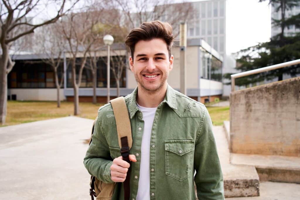 Portrait,Of,A,Young,Male,Student,Standing,Up,And,Looking